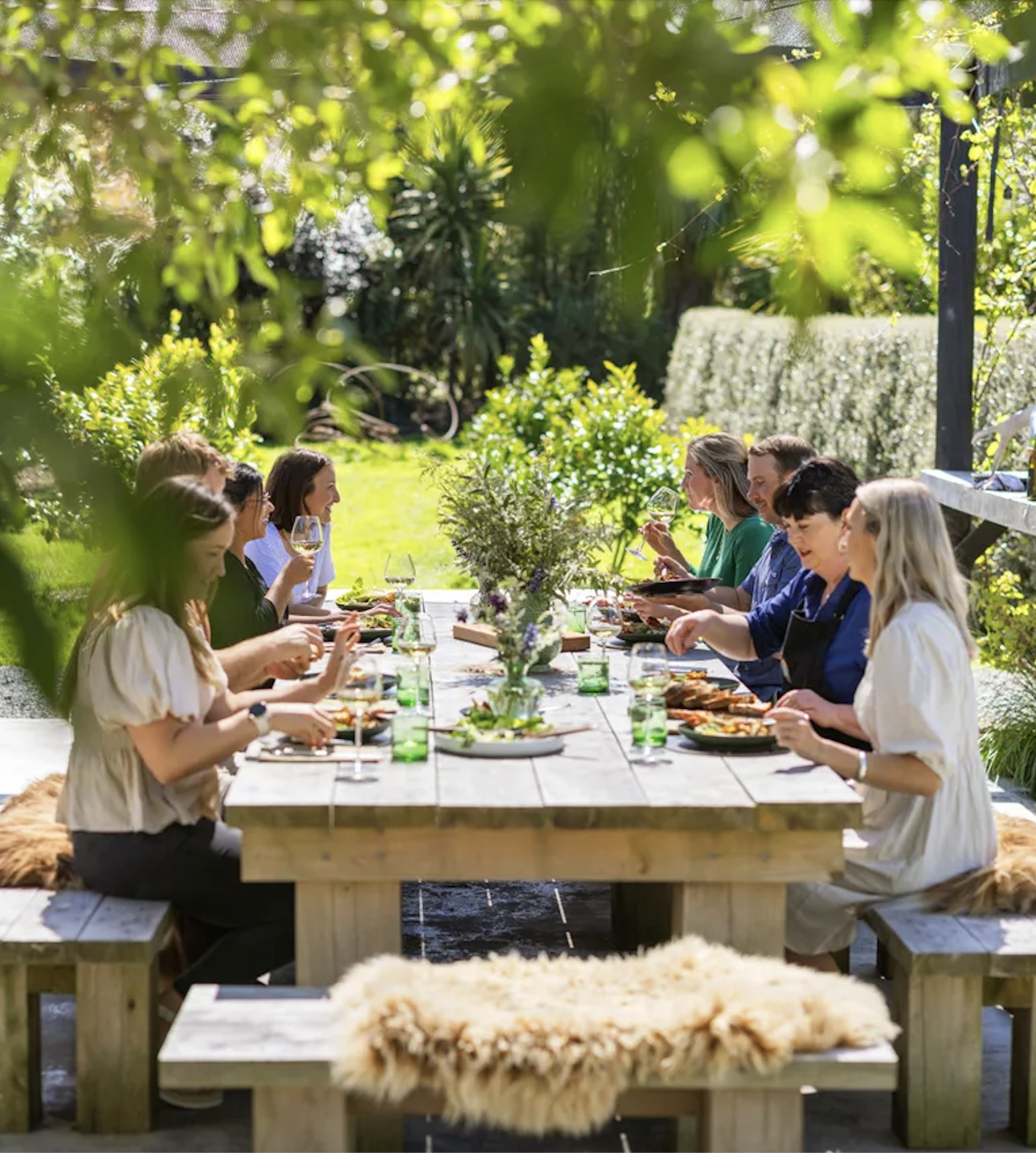 Delegates share an outdoor group lunch at Canterbury New Zealand