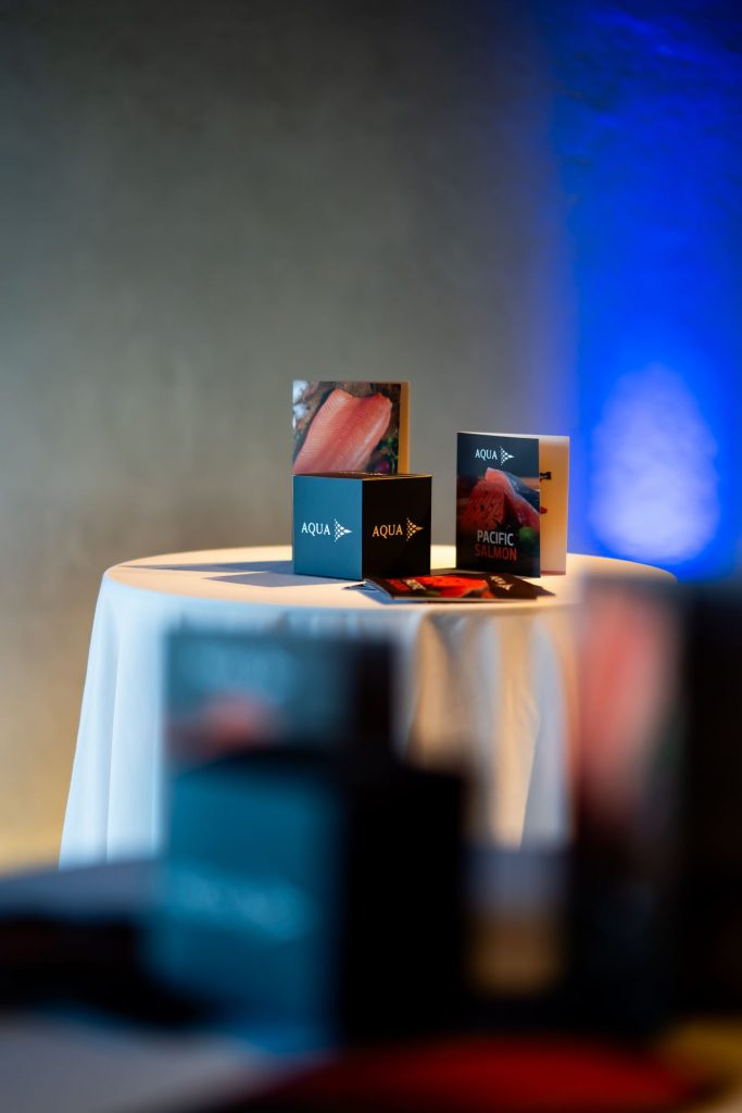 Event collateral placed on table at AquqChile launch event by On Purpose Events